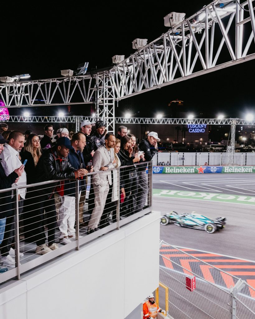 crowd watching cars on Turn 1 balcony