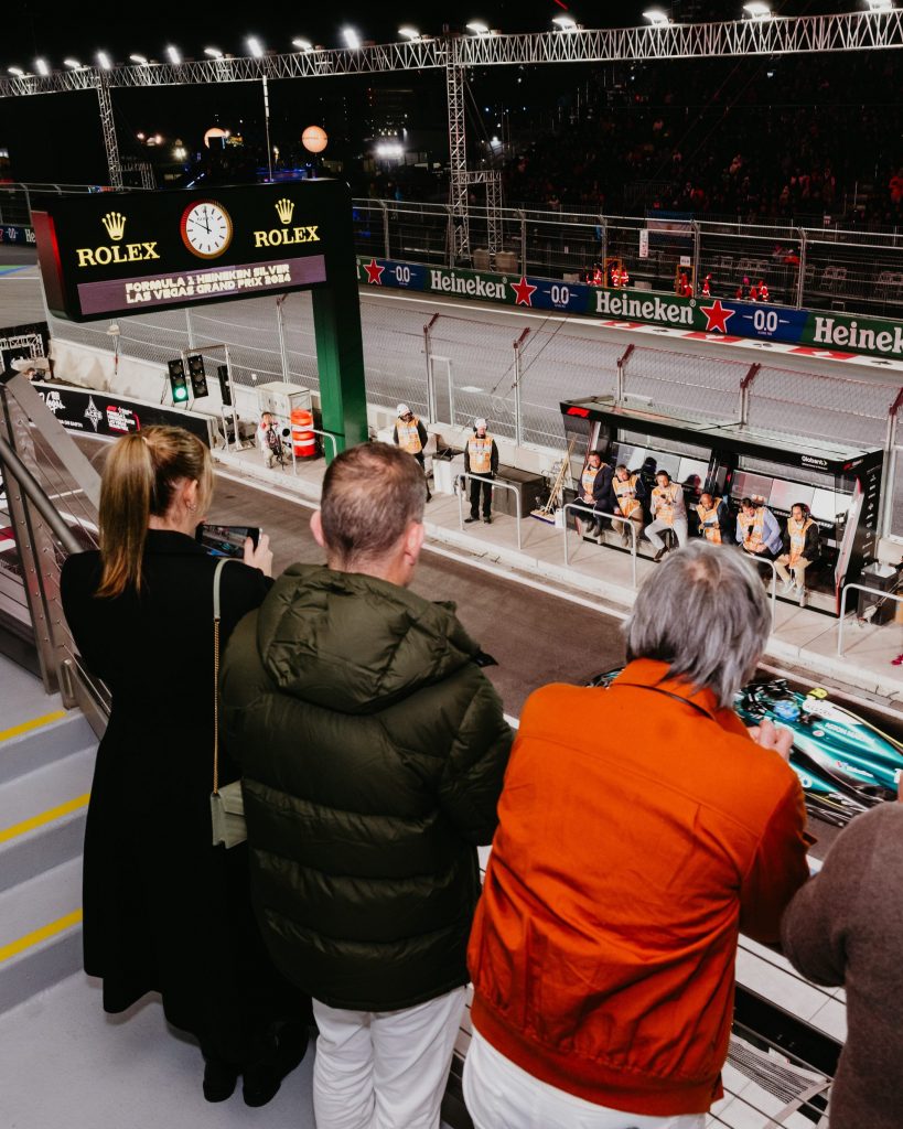 group overlooking pit lane exit