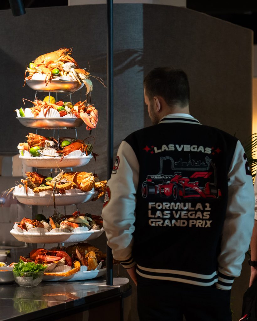 person walking past seafood tower
