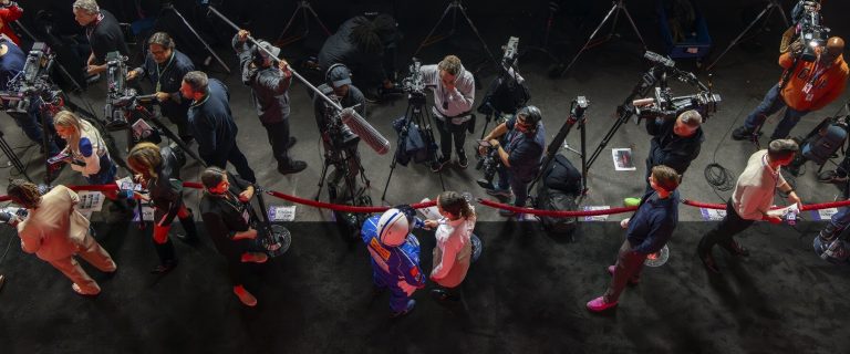 Media interviewing a driver